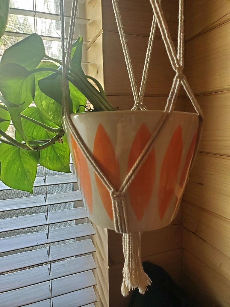 Early 60's inspired ceramic and macrame. My husband threw the pot and I glazed.