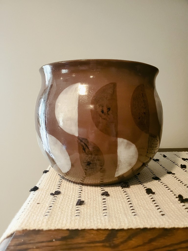 Pottery corner. My husband threw the pot and I glazed it, teamwork!
